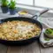 Creamy skillet dinner featuring shredded chicken, tortillas, and melted cheese inspired by Quick Chicken Enchilada Skillet and Healthy Sour Cream Chicken Enchiladas, perfect for fans of Rotisserie Chicken Skillet Recipes and easy weeknight meals.
