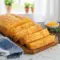 Golden Easy Bread Loaf filled with melted cheddar cheese, inspired by Savoury Bread Recipes and Retro Recipes 1970s, sliced on a wooden board for a cozy homemade vibe.