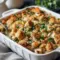 Bubbly, cheesy bake of shredded rotisserie chicken and seasoned stuffing with a crisp top — a top Rotisserie Chicken Recipes pick inspired by savory Stuffing Recipes and perfect for Easy Casserole Recipes.