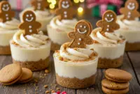 Adorable No-Bake Gingerbread Cheesecake Cups Sweet Appetizers for Christmas Party1 Mini no-bake gingerbread cheesecake cups layered with spiced cookie crust and creamy filling, decorated for the holidays as Cute Holiday Food, perfect as Festive Finger Food and ideal for Easy Baking Christmas gatherings; charming Christmas Cute Recipes that double as Christmas Gourmet Desserts with simple Christmas Dessert Decor, making them a delightful Christmas’s Dessert, great Christmas Sweets To Make, and adorable Sweet Appetizers For Christmas Party.
