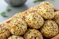 Golden, fluffy bagel bites shown as a High Protein Morning Snack, topped with seasoning for Everything But The Bagel Recipes, displayed as Baked Protein Bites perfect for Snacks Ideas For Work, easy Protein Snack Ideas On The Go, or simple High Protein Lunch Ideas For School, great for fans of Prime Protein Recipes, filled and chewy High Protein Bites, ideal when you want More Protein in every bite.