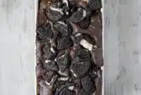 Epic Cookies and Cream Bread – Your New Favorite Oreo Chocolate Bread1 A thick slice of moist cookies and cream loaf cake packed with Oreo chunks and chocolate chips, topped with crumbled cookies for a rich and irresistible Oreo chocolate bread.