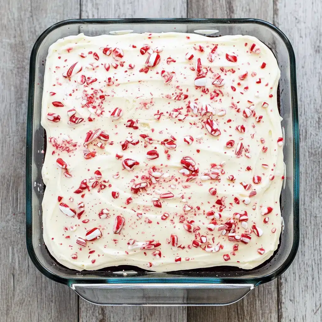 Cheesecake Cake with chocolate layers and creamy cheesecake swirls, frosted with Delicious Cream and crushed candy canes, displayed as a festive Christmas Cake alongside other Holiday Desserts, ideal for Christmas Cooking, Holiday Baking, and fans of Delicious Cake Recipes, Christmas Food Desserts, and Banana Chocolate Chip treats.