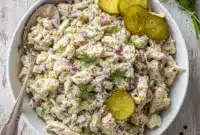 Flavor-Packed Dill Pickle Chicken Salad – Easy Prep Food Ideas for Busy Days3 Bowl of creamy dill pickle chicken salad made with shredded chicken, crunchy pickles, and fresh herbs — a flavorful recipe featuring Dishes With Pickles, perfect for easy lunches and busy-day meal prep.
