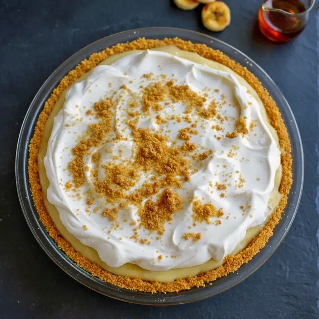 A luscious bourbon banana cream pie topped with fluffy whipped cream and cookie crumbs, showcasing rich banana layers and a boozy twist—perfect for fans of Dinner Desserts, Banana Cream Pie Flavor, Bourbon Cream Pie, Banana Whiskey Pie Recipe, Pie Recipe With Bourbon, Banana Cream Pie Recipe Inspiration, Banana Bourbon Pie, Bourbon And Pie, and Bananas Foster Cream Pie.