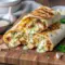 Golden, crispy Low Carb Cheesy Garlic Chicken Wraps sliced open to show melted cheese and tender chicken, ideal for Chicken Meal Prep Ideas Low Carb, Quick Dinner Low Carb, and Easy Low Carb Lunch Meal Prep meals.