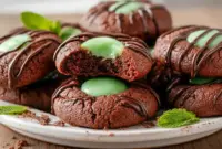 Overhead view of Chocolate Mint Thumbprint Cookies on a festive plate, showcasing rich chocolate cookies with smooth mint centers, ideal for holiday baking and classic Mint Chocolate Desserts inspiration.