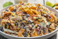 Unforgettable Frito Cowboy Cabbage – A Bold Cabbage Cowboy Salad Everyone Craves1 Bowl of crunchy Cabbage Cowboy Salad packed with coleslaw mix, beans, corn, peppers, and Fritos, tossed in creamy chipotle dressing, perfect as a flavorful Salad To Take To A Party.
