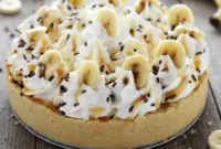 Slice of creamy banoffee pie topped with whipped cream and bananas, perfect for dessert inspiration, featuring Banoffee Pie Ideas, a Super Easy Banoffee Pie, a clear look at What Ingredients Do You Need For Banoffee Pie, and irresistible Banoffee Pie Recipe Inspiration.