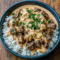 A hearty bowl of Steak And Rice topped with juicy Steak Bites, fluffy rice, and creamy Cheese Sauce For Steak, perfect for an easy homemade Steak Dinner the whole family will love.