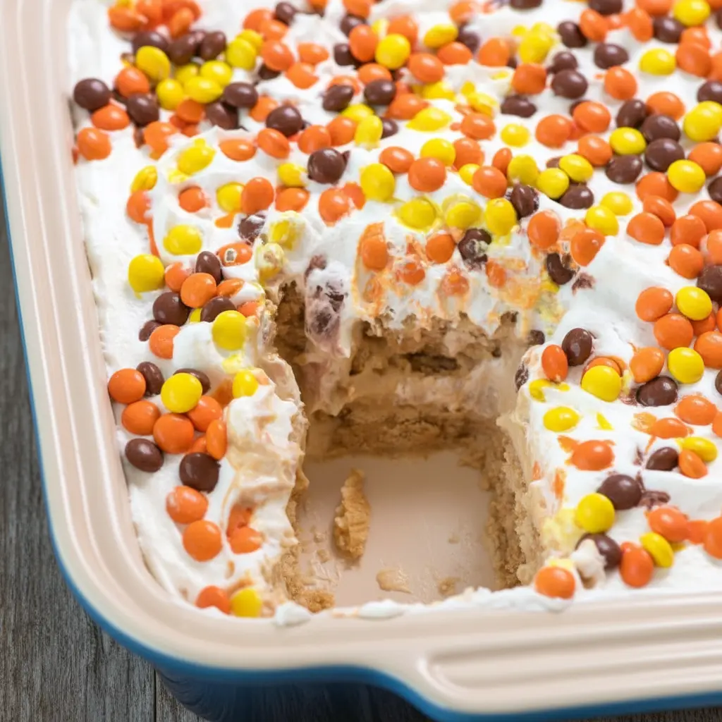 Layers of cookies and peanut butter filling in a chilled dessert, showing Fun Summer Dessert Ideas that are ideal for Cold Easy Desserts and no-oven entertaining.