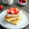 Healthy Cottage Cheese Breakfast oven pancakes baked on a sheet pan with fresh strawberries, a simple high-protein option from Cottage Cheese Recipes Healthy Breakfast that’s easy, fluffy, and perfect for meal prep.