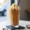 Icy blended Caramel Macchiato Protein Shake with coffee, chocolate protein powder, and caramel flavor, served as a creamy Caramel Coffee Protein Shake that doubles as a smooth Chocolate Caramel Protein Shake, perfect for a healthy homemade Salted Caramel Protein Shake Recipe.