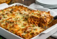 A baked dish of High Protein Spaghetti Casserole layered with hearty meat sauce, protein pasta, and golden melted cheese, perfect for an Easy High Protein Casserole dinner that feels indulgent but fuels your day.