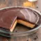 Slice of Peanut Butter Pie With Chocolate Ganache featuring a creamy Skrewball peanut butter filling, Oreo crust, and a rich Peanut Butter Pie With Chocolate Ganache Topping perfect for fans of bold Peanut Butter Skrewball Recipes.