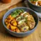Bowl of maple Dijon chicken served with caramelized sweet potatoes, showcasing Yummy Healthy Dinner Ideas and flavorful Recipes With Roasted Sweet Potatoes for a balanced homemade meal.