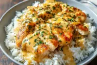 Hearty skillet of smothered chicken served over fluffy rice, showcasing Perfect Winter Meals comfort and creamy Comfort Food With Gravy goodness.