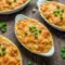 Crawfish Au Gratin Recipe Easy baked in a casserole dish with creamy cheese sauce, tender crabmeat, Cajun spices, and golden melted cheese, styled as a classic Crab Au Gratin New Orleans–inspired seafood dish.