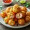 Golden fried crab rangoon bombs plated hot and crisp — this Seafood Delight Recipe showcases creamy seafood centers inside crunchy wrappers, perfect Appetizer Snacks for sharing.