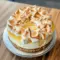 A slice of Lemon Meringue Cheesecake with a buttery crust, smooth lemon filling, glossy lemon curd, and golden meringue topping—an irresistible choice for Lemon Desserts and classic Homemade Cheesecake lovers.