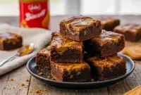 Biscoff Brownies with a crackly top and thick, fudgy texture, featuring dramatic Biscoff Swirls and layers of rich Cookie Butter Brownies baked to perfection.