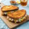 Crab Melt Sandwich Recipes featuring a golden, toasted Classic Crab Melt Recipe made with lump crab meat, melted cheddar cheese, and Old Bay seasoning in a crave-worthy Seafood Grilled Cheese Sandwich Recipe.
