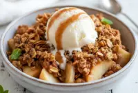 Warm ramekin apple crisp highlighting Healthy Dessert Ideas With Fruit, topped with golden crumble — a High Protein Baked Snacks option that looks rich, cozy, and guilt-free.
