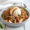 Warm ramekin apple crisp highlighting Healthy Dessert Ideas With Fruit, topped with golden crumble — a High Protein Baked Snacks option that looks rich, cozy, and guilt-free.