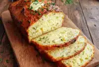 Freshly sliced Cottage Cheese Bread Recipe loaf with a golden crust and tender interior, showcasing a protein-packed Easy Healthy Bread ideal for low-carb sandwiches and toasting.
