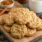 Soft, chewy No Bake Cookie Butter Cookies stacked on a plate, showing their glossy cookie butter finish and oat texture — an irresistible no-oven treat inspired by No Bake Biscoff Cookies.