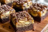 A tray of Tasty Treats To Make featuring fudgy banana bread brownies sliced into squares, showcasing a dense chocolate center ideal for Easy Desserts Banana fans and irresistible Banana Brownie Recipes cravings.