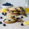 Golden Lemon Blueberry Cookies coated in lemon sugar with juicy blueberry streaks, styled as fresh Cookies For Spring and vibrant Dessert Recipes Blueberry inspiration.