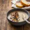 A warm bowl of Mushroom Bisque Soup Recipes featuring a smooth Savory Mushroom Soup with a silky texture, perfect for fans of Best Mushroom Soup Recipes and cozy homemade Gourmet Soups.