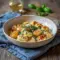 Golden, saucy gnocchi plated with herbs and cheese, showcasing luxe Fanciest Food comfort appeal — a creamy Gnocchi Pasta Recipe perfect for an elevated dinner moment.