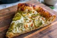 Dill Pickle Pizza With Ranch Sauce — Tangy Comfort Favorite1 Golden baked Dill Pickle Pizza With Ranch Sauce topped with melted mozzarella, creamy Dill Pickle Pizza Sauce, and tangy dill pickle slices on a crispy crust, a bold and flavorful Pickle Ranch Pizza perfect for pickle lovers.