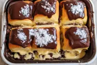 Delicious Boston Cream Pie stuffed Hawaiian Rolls filled with cream and topped with chocolate, perfect for Quick Desserts and indulgent Sweet Treats Desserts.
