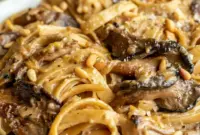 Caramelized Leek and Mushroom Gruyère Pasta — Cozy Gourmet Dinner1 Caramelized Leek and Mushroom Gruyere Pasta served in a shallow bowl, coated in a creamy sauce with browned mushrooms, tender leeks, and melted cheese—an elegant option for cozy Pasta Dinner Recipes and hearty Vegetarian Dishes.