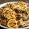 Caramelized Leek and Mushroom Gruyere Pasta served in a shallow bowl, coated in a creamy sauce with browned mushrooms, tender leeks, and melted cheese—an elegant option for cozy Pasta Dinner Recipes and hearty Vegetarian Dishes.