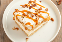 Creamy layered Apple Lasagna topped with whipped topping and spiced apples, a delicious No Bake Apple Dessert and perfect Easy Fall Dessert Recipe for festive Thanksgiving Dessert Ideas.