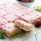 Freshly glazed Strawberry Lemon Blondies sliced into squares, topped with strawberry lemon drizzle, a vibrant Strawberry Keto Dessert and one of the best Strawberry Desserts Keto options for a bright, low carb treat.