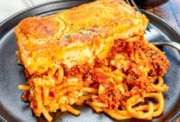 Golden baked Cheddar Bay Spaghetti Casserole topped with cheesy biscuit crust makes the ultimate Cheesy Pasta Casserole for dinner night.