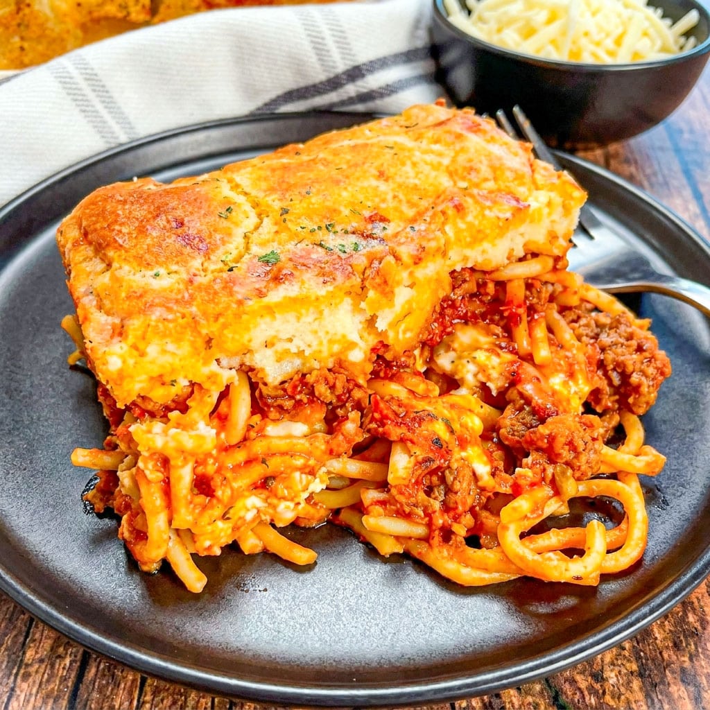 Golden baked Cheddar Bay Spaghetti Casserole topped with cheesy biscuit crust makes the ultimate Cheesy Pasta Casserole for dinner night.