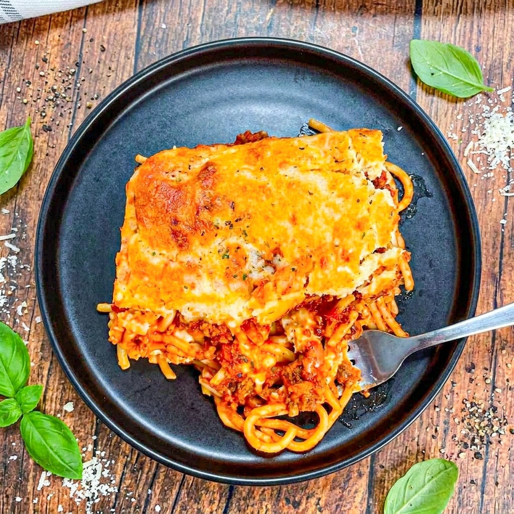 Golden baked Cheddar Bay Spaghetti Casserole topped with cheesy biscuit crust makes the ultimate Cheesy Pasta Casserole for dinner night.