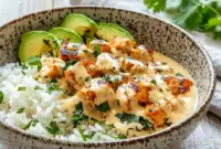 Creamy Coconut Chicken Rice Bowl Ready in Under 30 Minutes1 Creamy Coconut Chicken Rice Bowl served with tender chicken, fluffy rice, fresh herbs, and rich coconut sauce for an easy tropical dinner. Perfect for quick Easy Healthy Dinner With Rice and cozy Dinner Ideas Healthy Bowls.