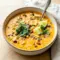 Creamy Chicken, Poblano, and Black Bean Soup served with cilantro and lime in a rustic bowl, inspired by Southwest Chicken Poblano Soup and cozy Poblano Pepper Recipes Soup ideas.