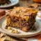 Freshly baked Pumpkin Brownies with rich chocolate swirls and pumpkin spice layers styled as gooey Pumpkin Chocolate Swirl Brownies on a fall dessert table.