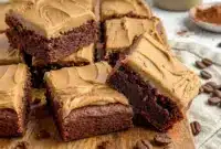 Rich and fudgy Coffee Brownies topped with creamy Brownies With Mocha Frosting and served as decadent Frosted Coffee Brownies dessert bars.