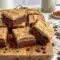Rich and fudgy Coffee Brownies topped with creamy Brownies With Mocha Frosting and served as decadent Frosted Coffee Brownies dessert bars.