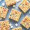Soft and gooey Protein Rice Krispies stacked on a plate with melted marshmallows and colorful sprinkles, perfect for easy Low Calorie Protein Rice Crispy Treats and homemade Rice Krispie Protein Bar ideas.