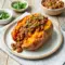 Loaded Sloppy Joe Sweet Potatoes topped with savory ground beef sauce and fresh herbs for an easy healthy dinner. These cozy Whole30 Sloppy Joes and Paleo Sweet Potato Sloppy Joes make the perfect comfort food meal prep idea.